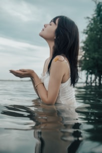 A woman standing in a body of water