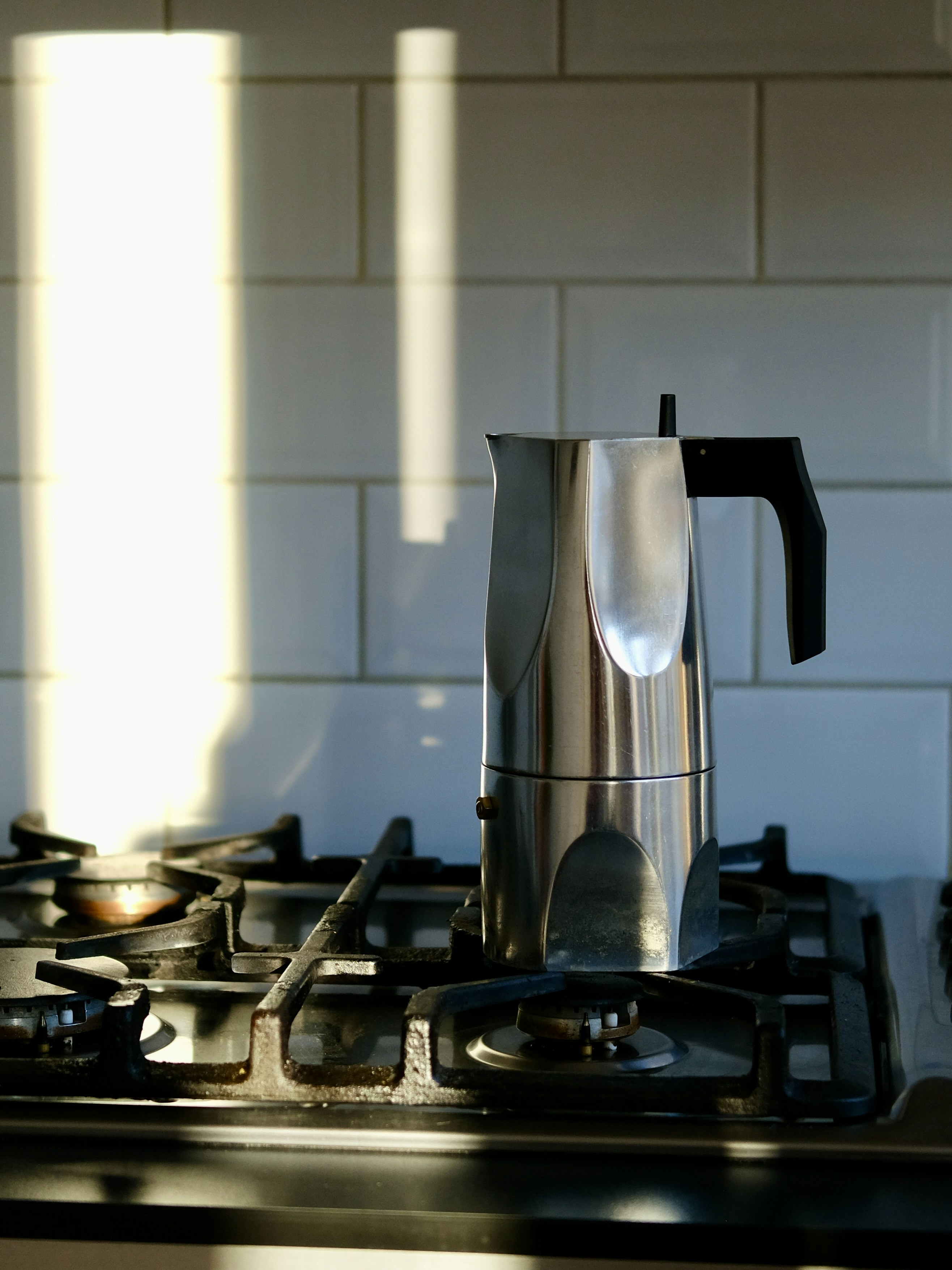 A coffee pot sitting on top of a stove