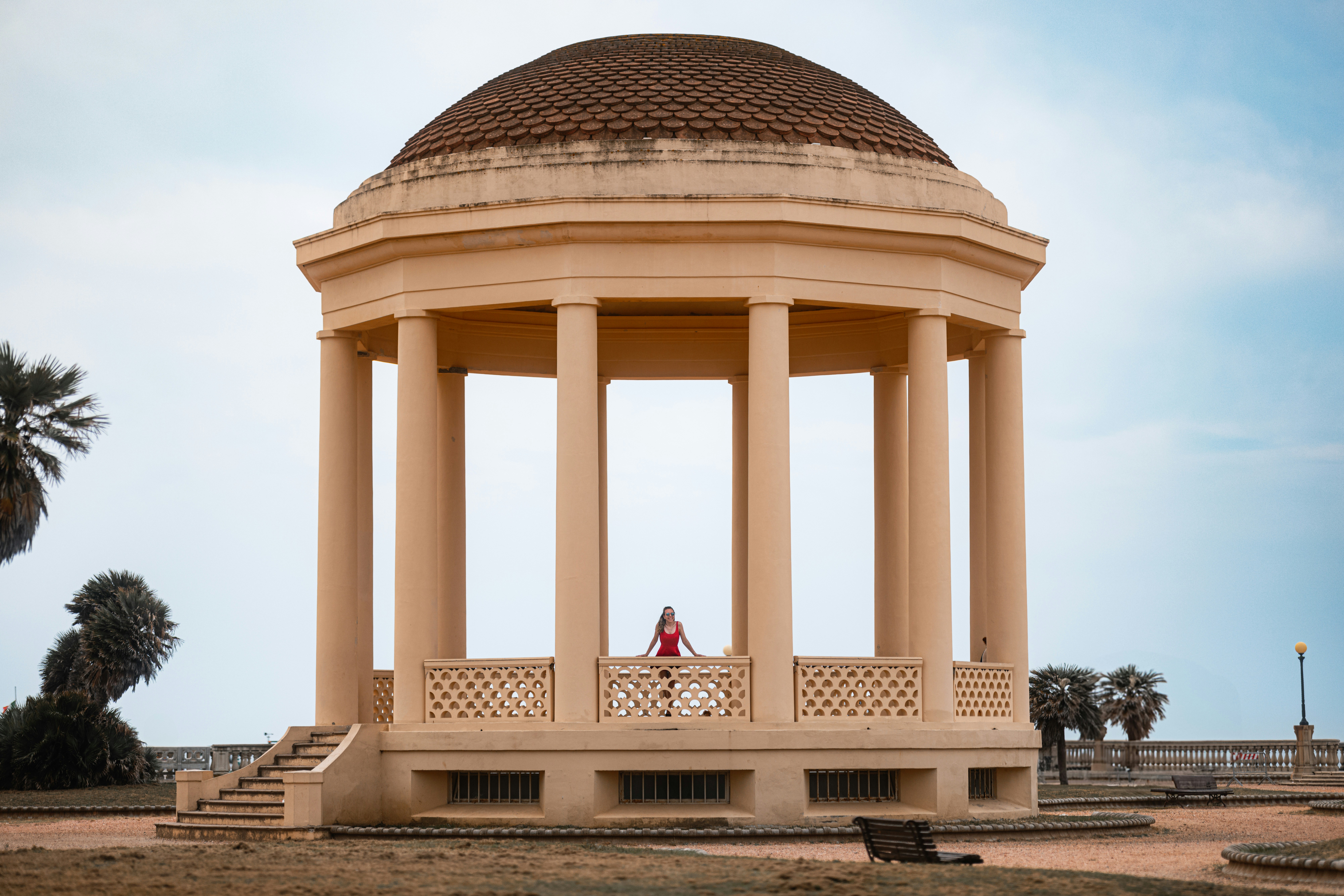 A couple of people standing in front of a gazebo