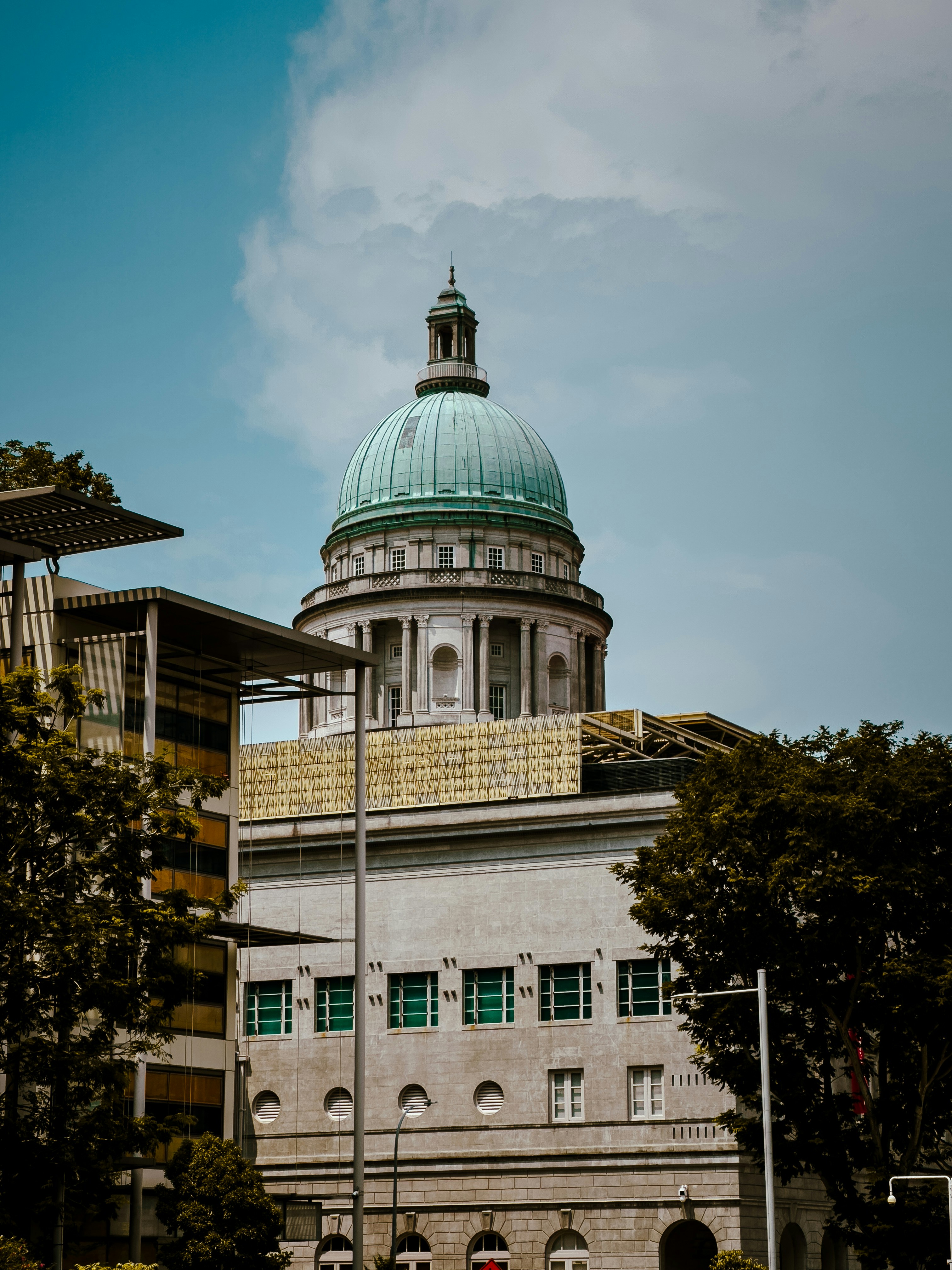 A large building with a green dome on top