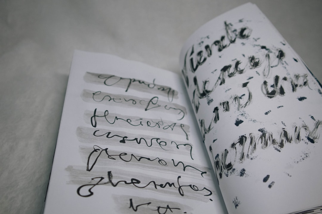 An open book with writing on it,