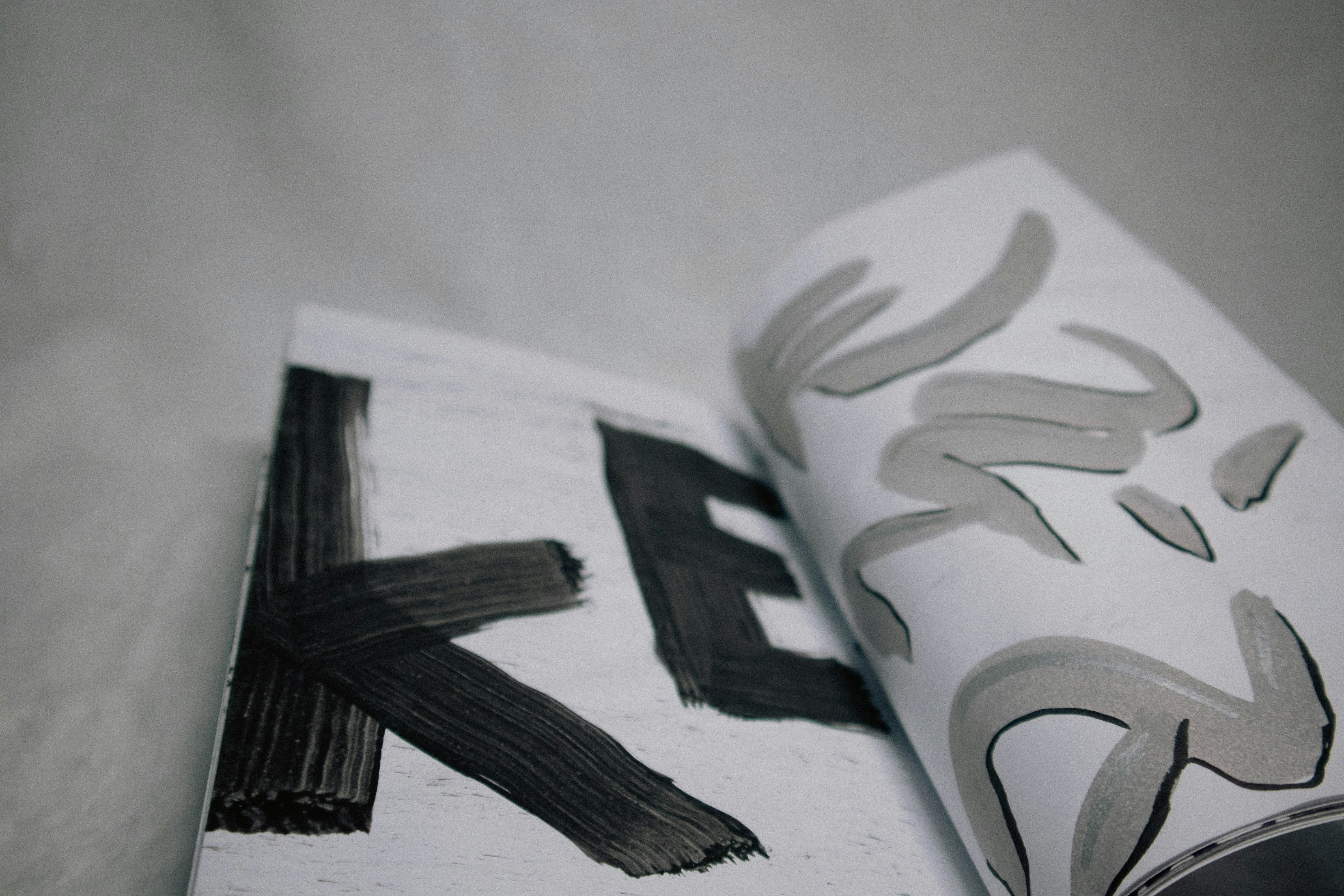 A white book with black and white designs on it