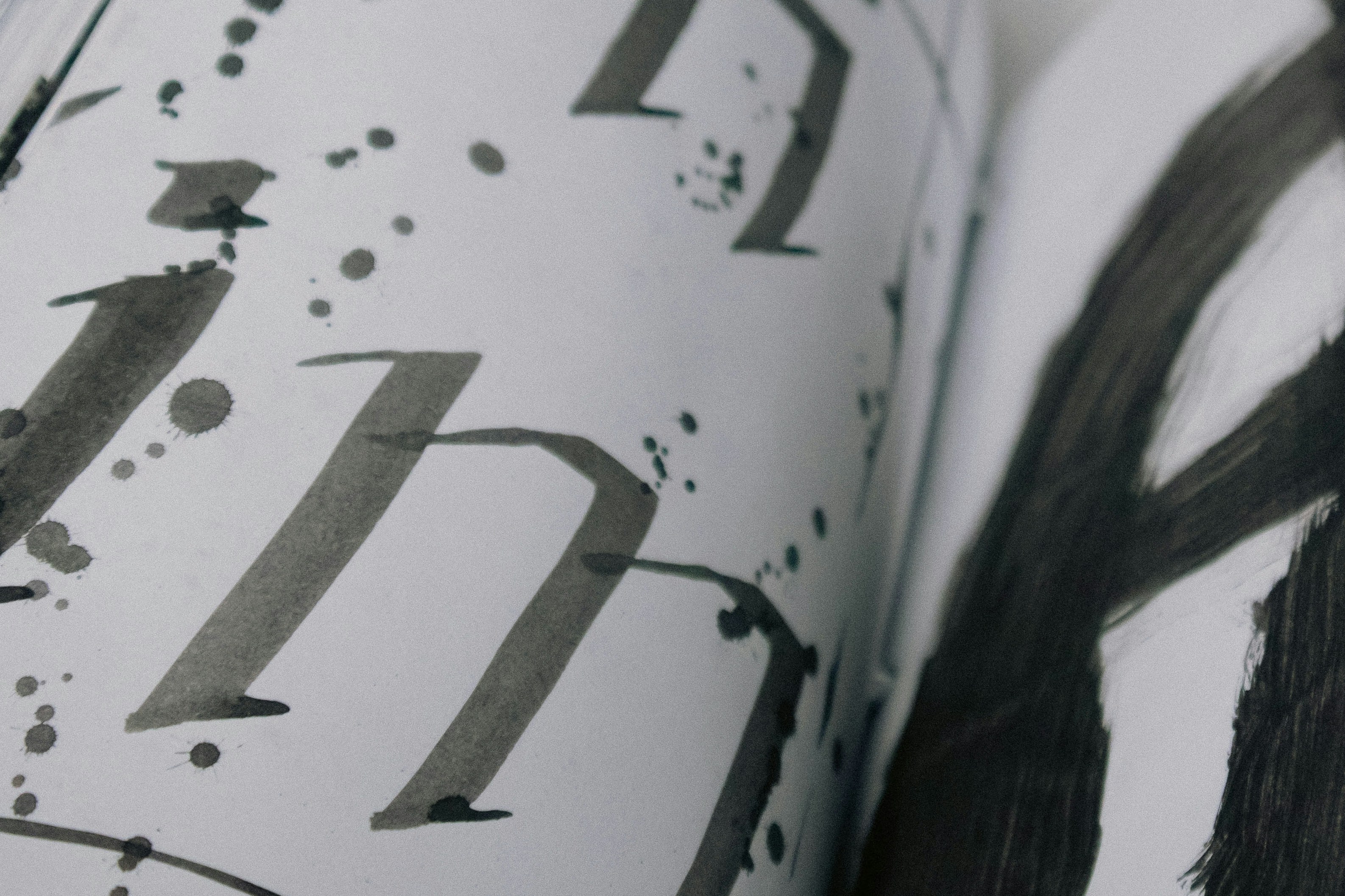 A close up of an open book with black ink