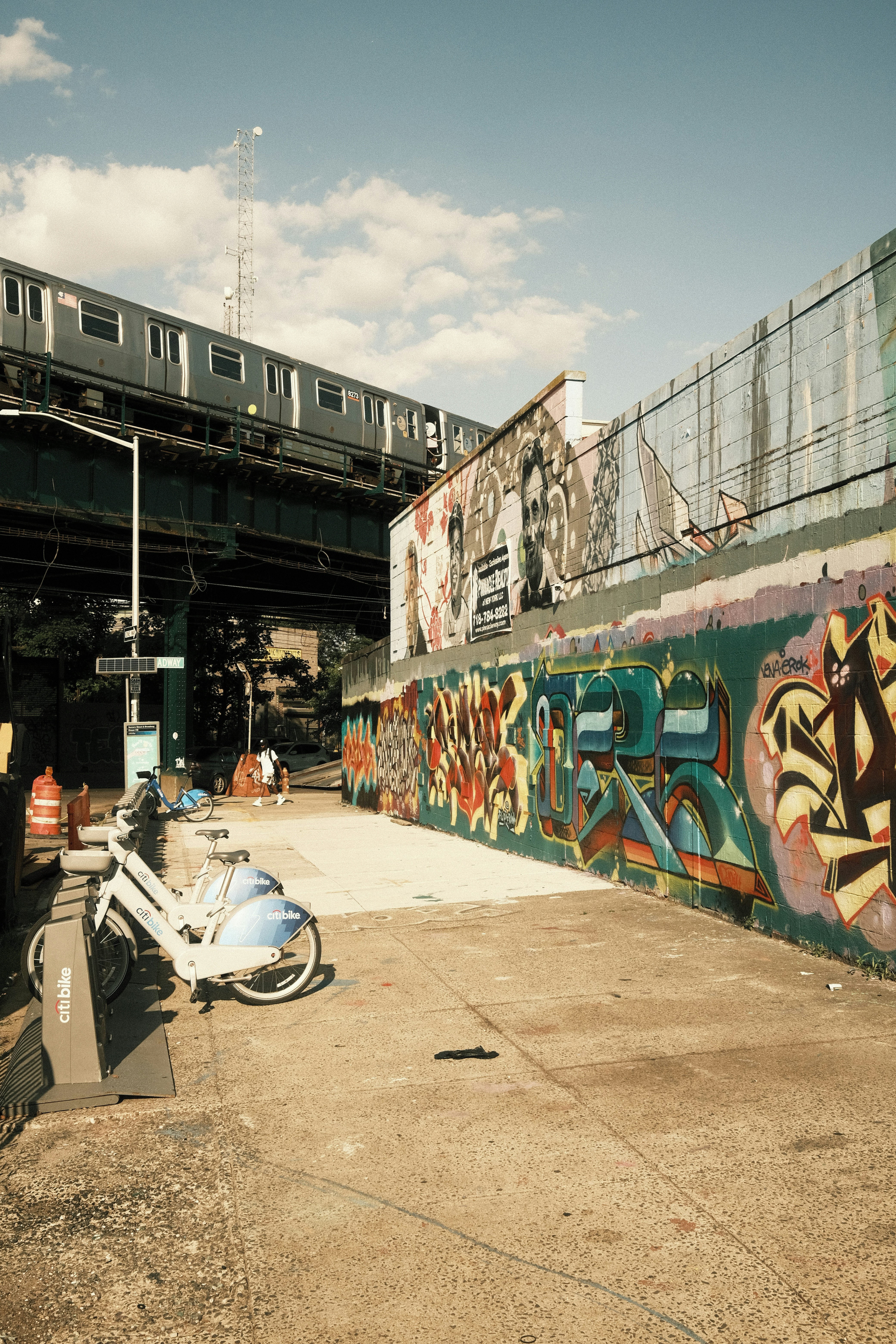 A motorcycle parked in front of a graffiti covered wall photo – Free ...