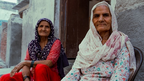 A couple of women sitting next to each other