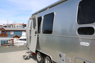 A silver trailer parked on top of a roof