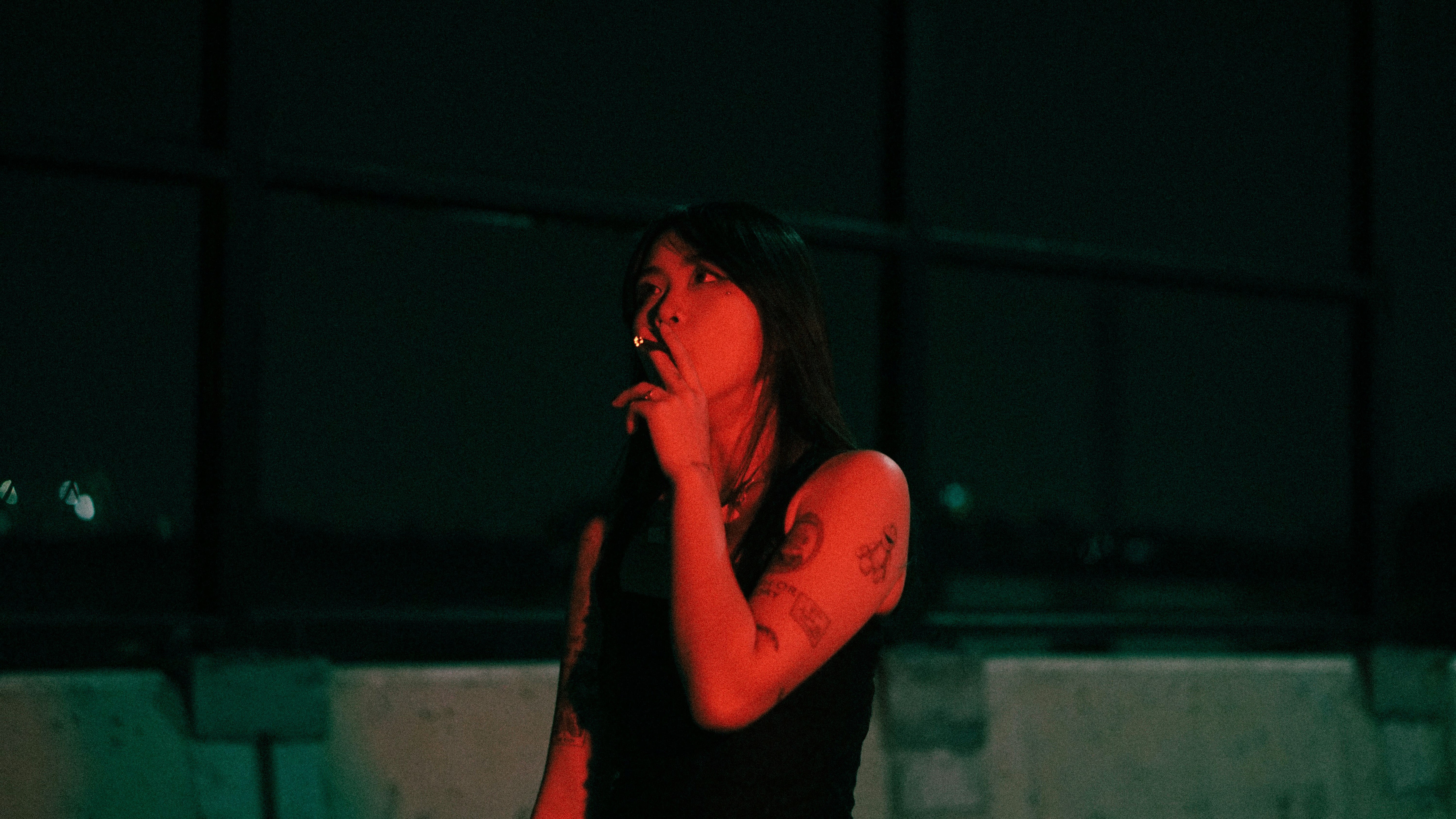 A woman in a black shirt talking on a cell phone