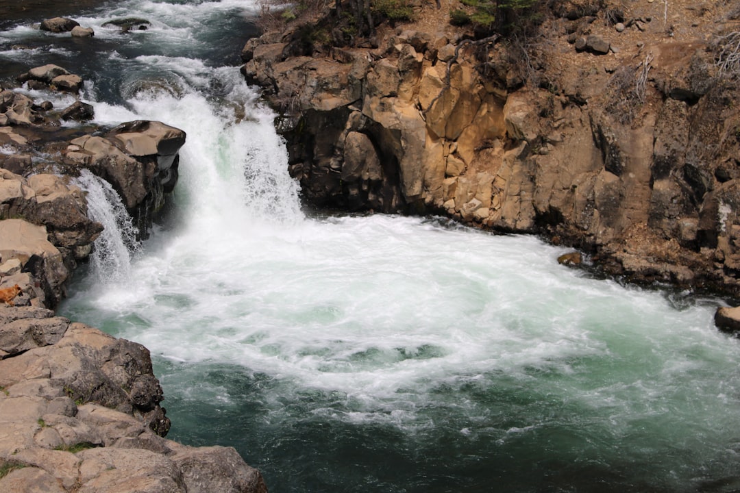 A river with a waterfall running through it