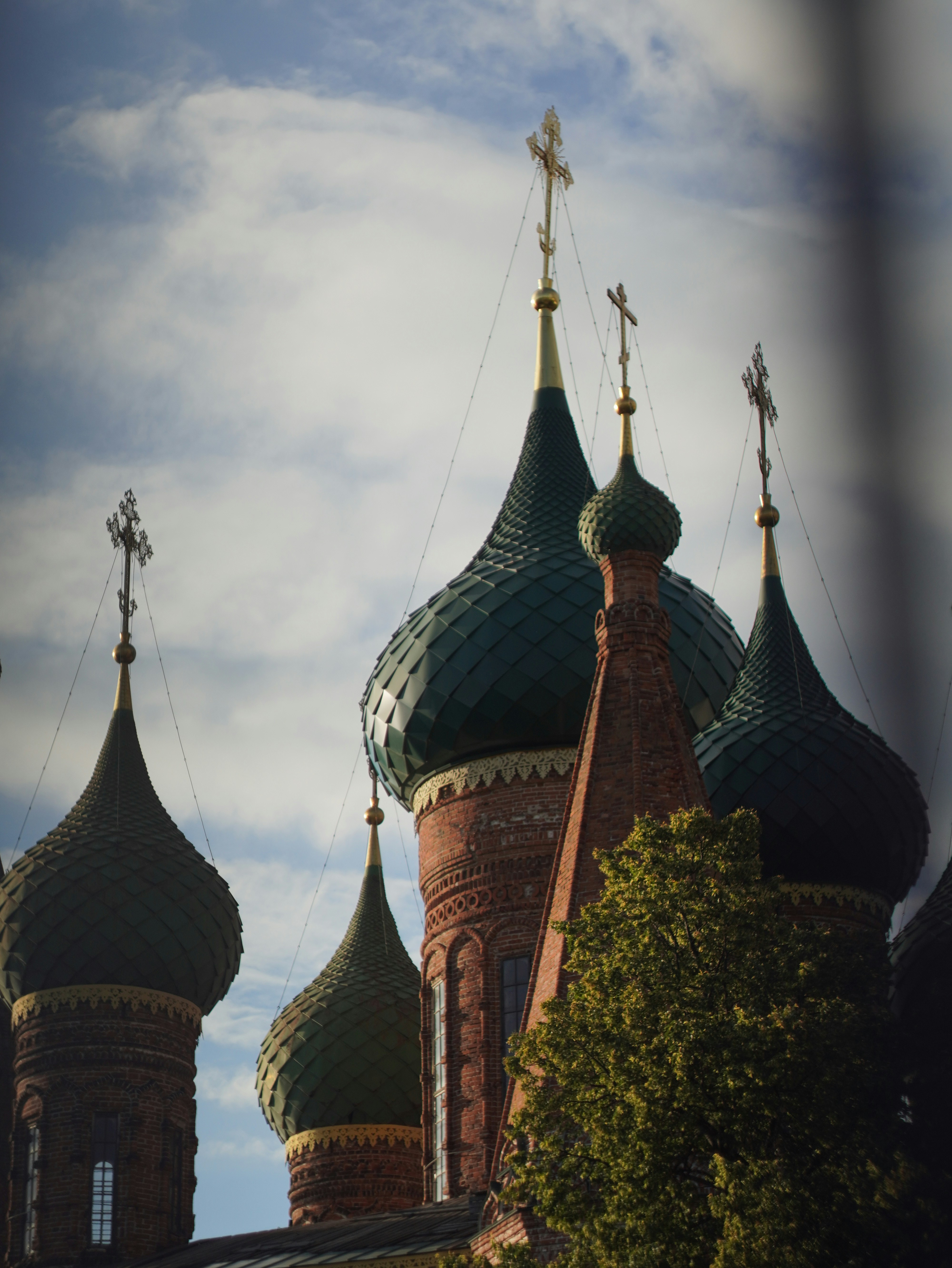 A large building with two towers and a cross on top