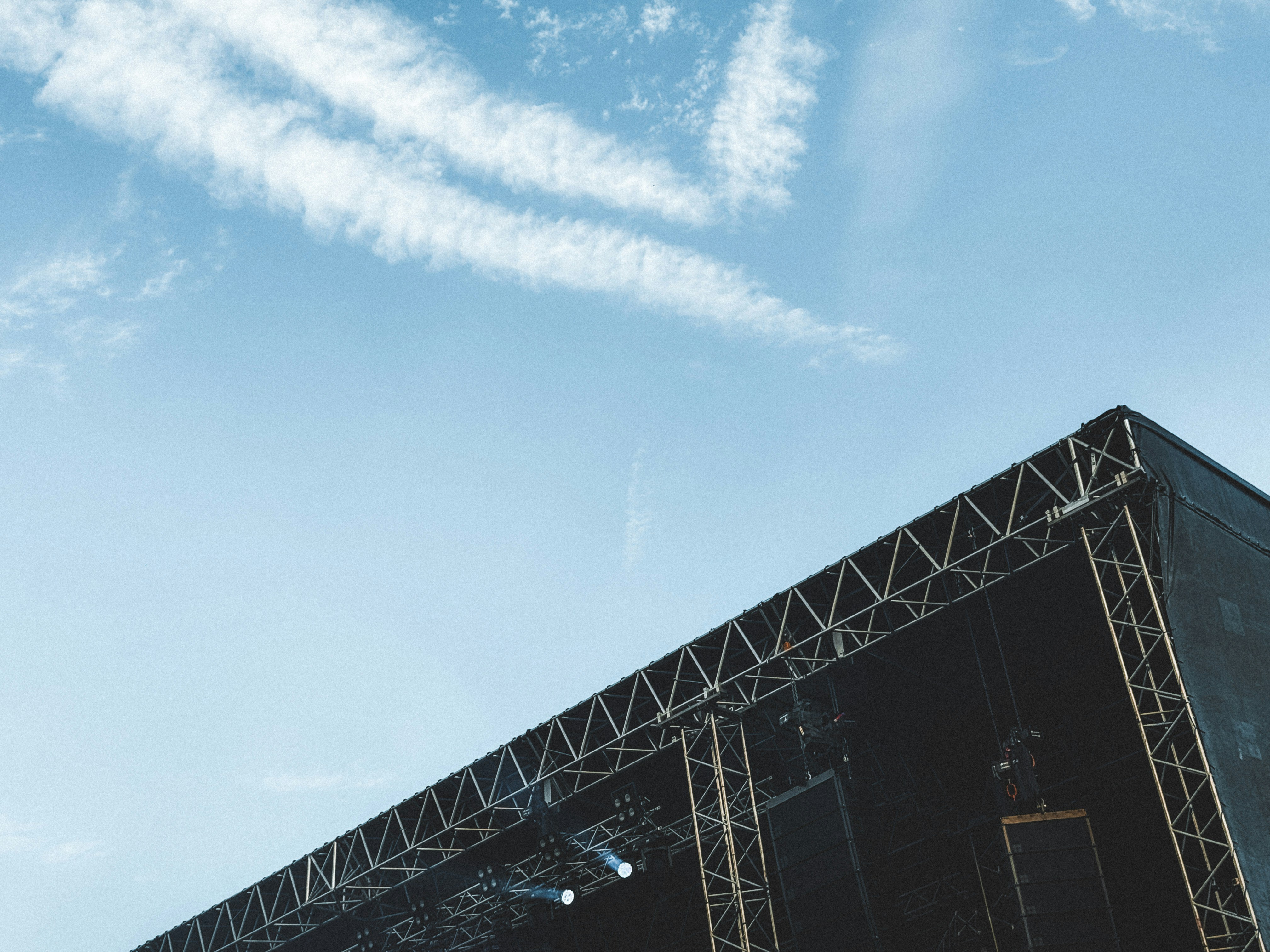 A stage set up for a concert under a blue sky photo – Free Image on ...