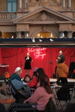 A group of people standing on top of a stage