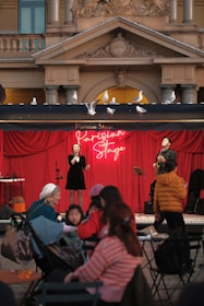 A group of people standing on top of a stage