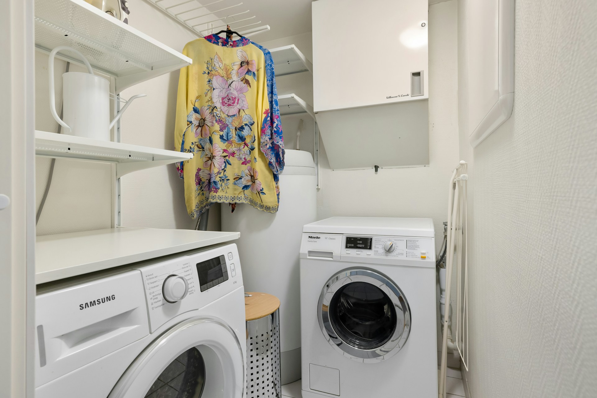 A laundry room with a washer and dryer