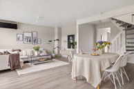 A living room filled with furniture and a white table