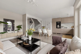 A living room filled with furniture and a large window