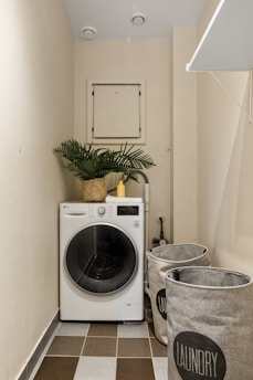 A laundry room with a washer and dryer