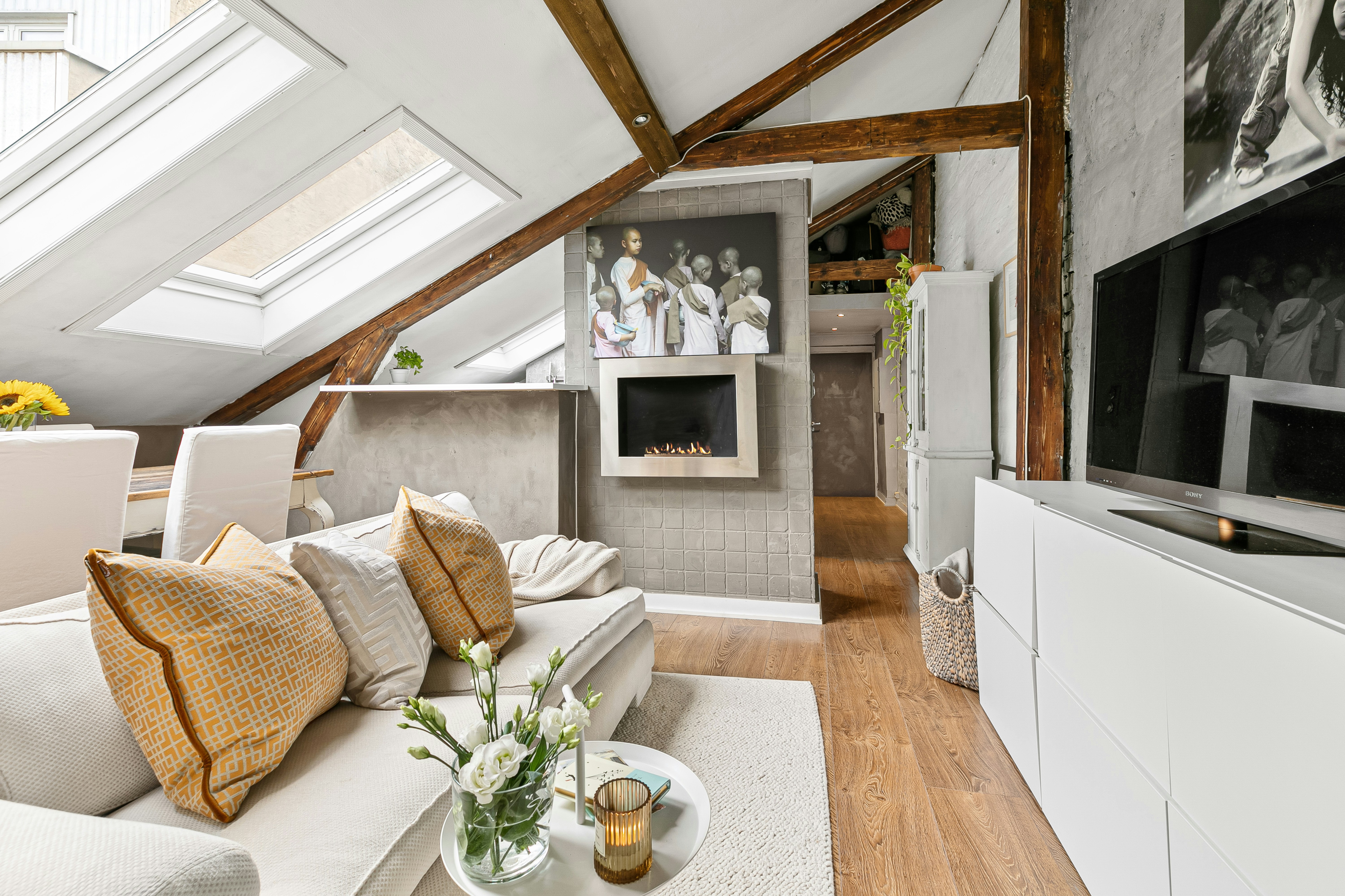 A living room filled with furniture and a flat screen TV
