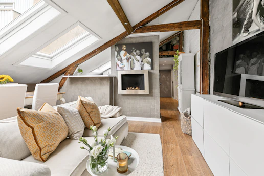 A living room filled with furniture and a flat screen TV