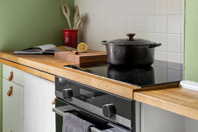 A stove top oven sitting inside of a kitchen