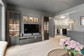 A living room filled with furniture and a flat screen TV