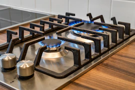A gas stove with a blue flame on it