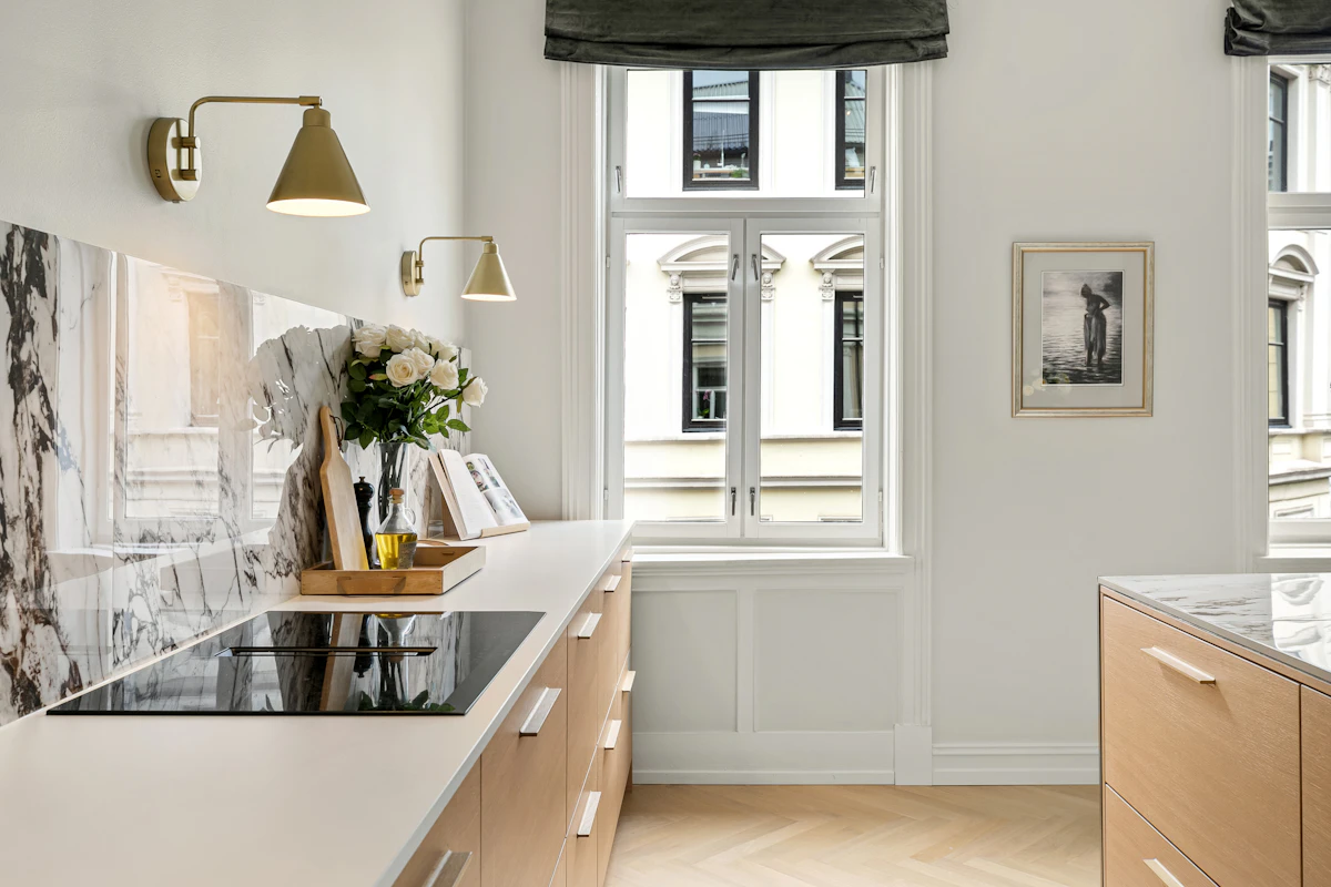 Small kitchen with one mostly clear wall and warm light