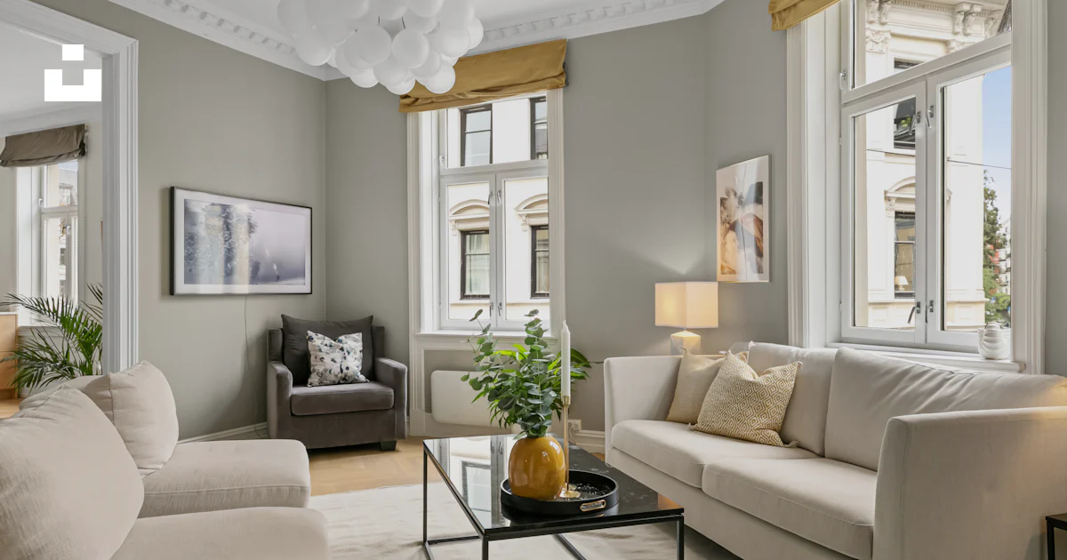 A living room filled with furniture and lots of windows photo – Free ...