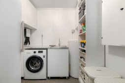 A laundry room with a washer and dryer