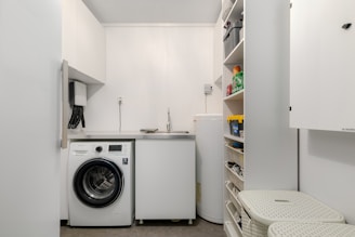 A laundry room with a washer and dryer