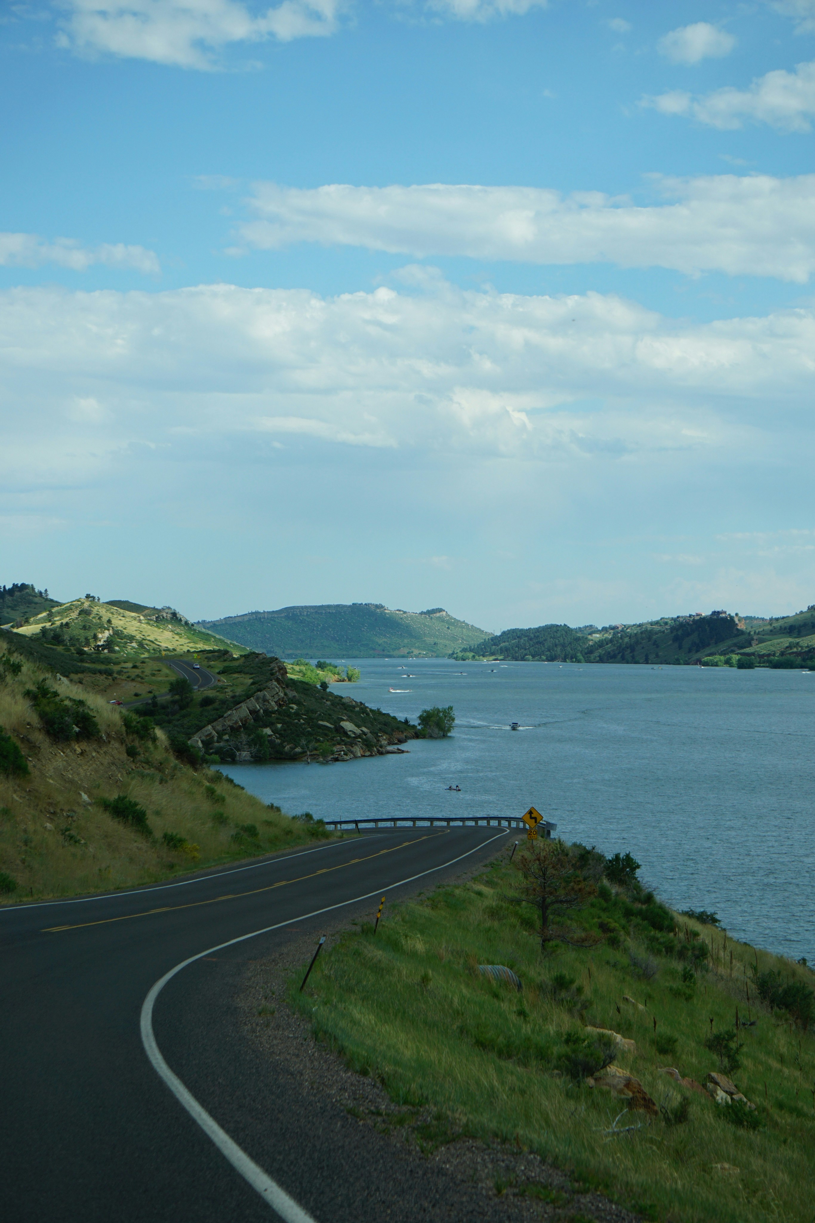 A view of a road next to a body of water