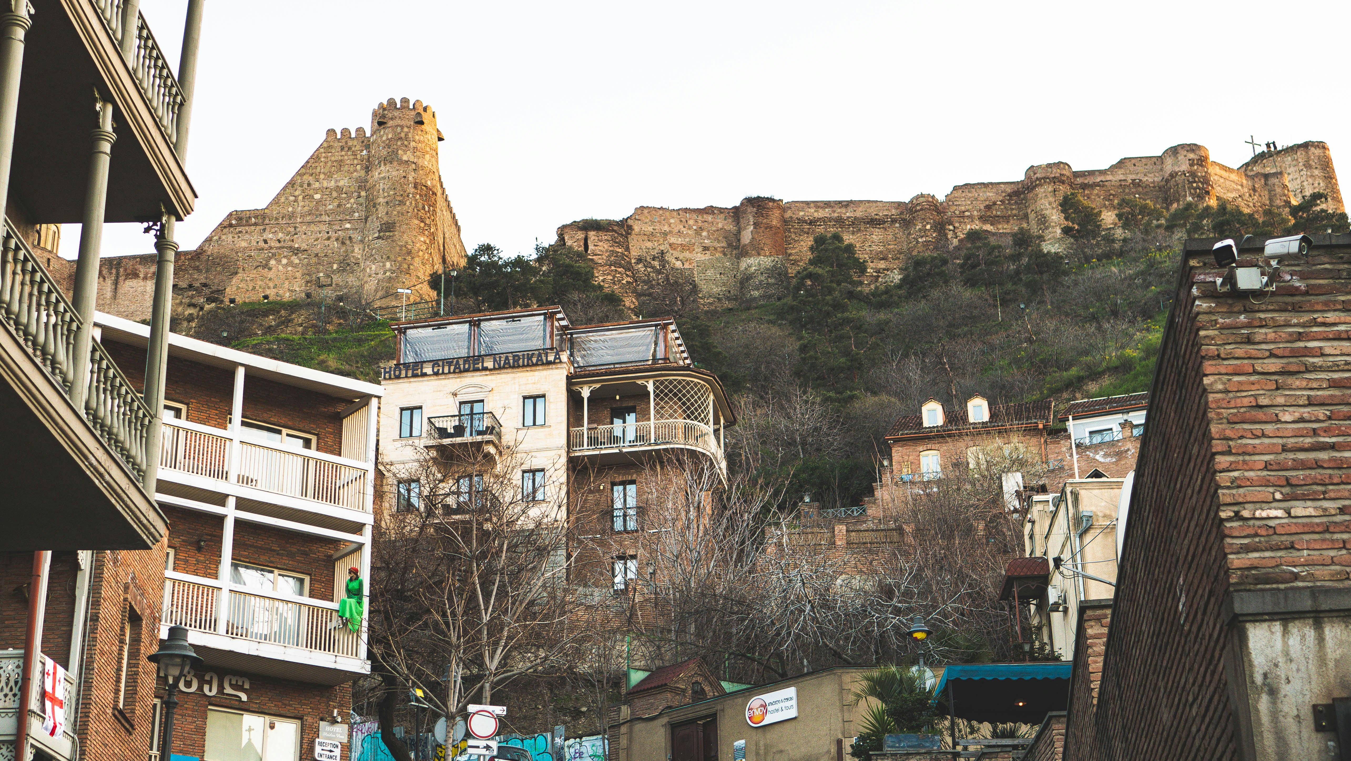 A city street with a mountain in the background