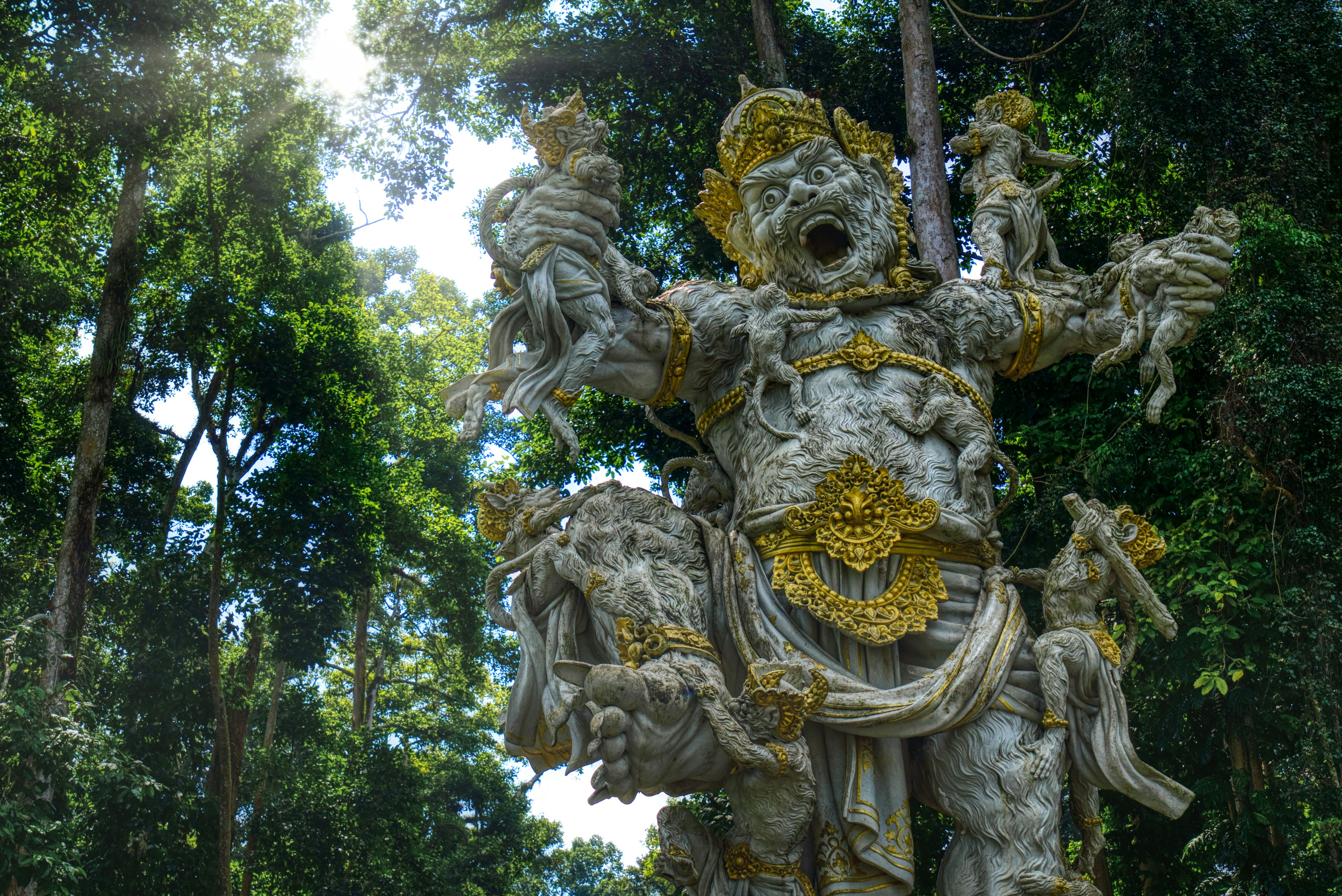 A statue in the middle of a forest