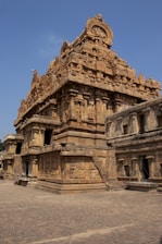 A large stone structure with a clock on top of it