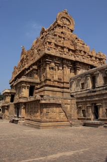 A large stone structure with a clock on top of it