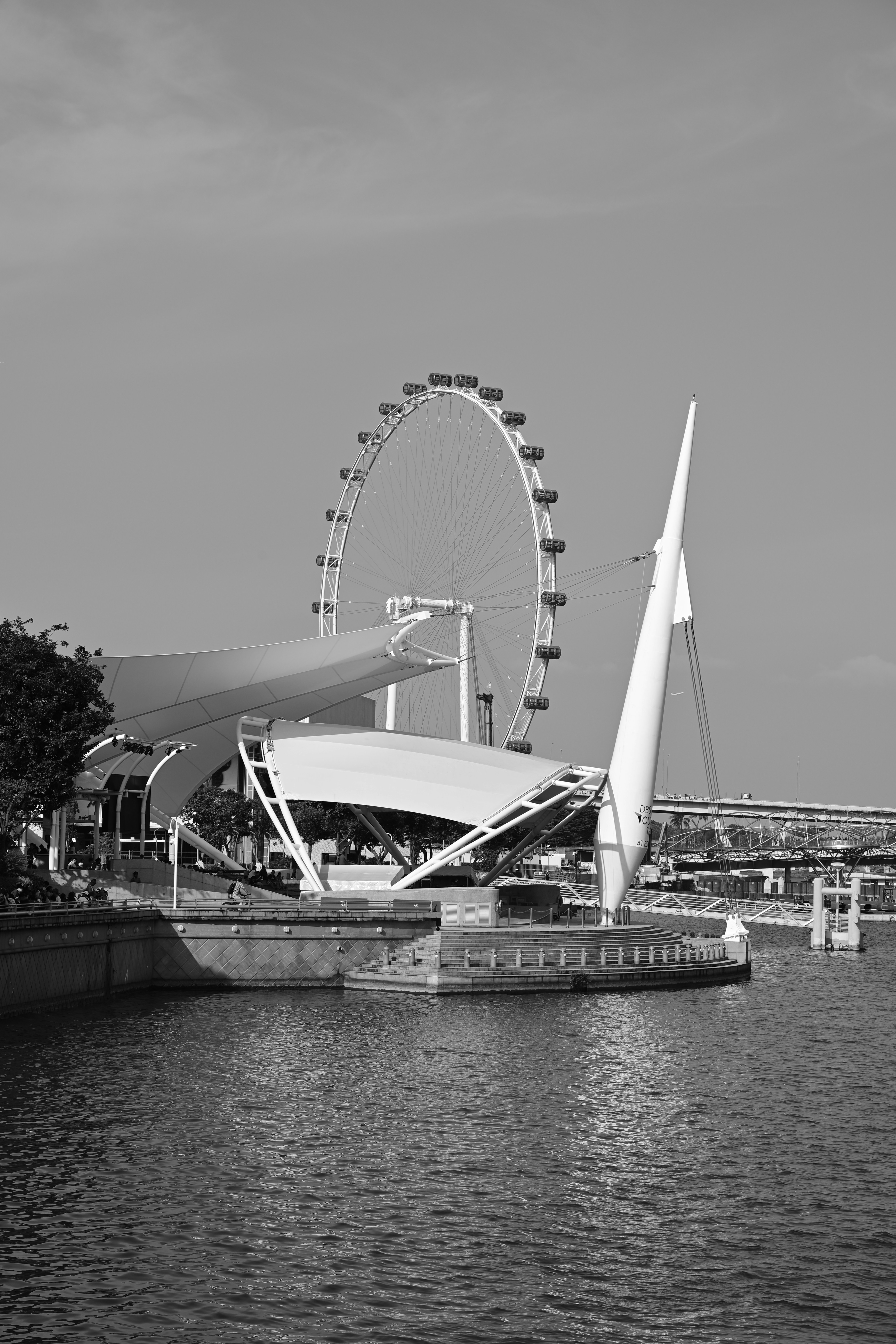 A black and white photo of a ferris wheel