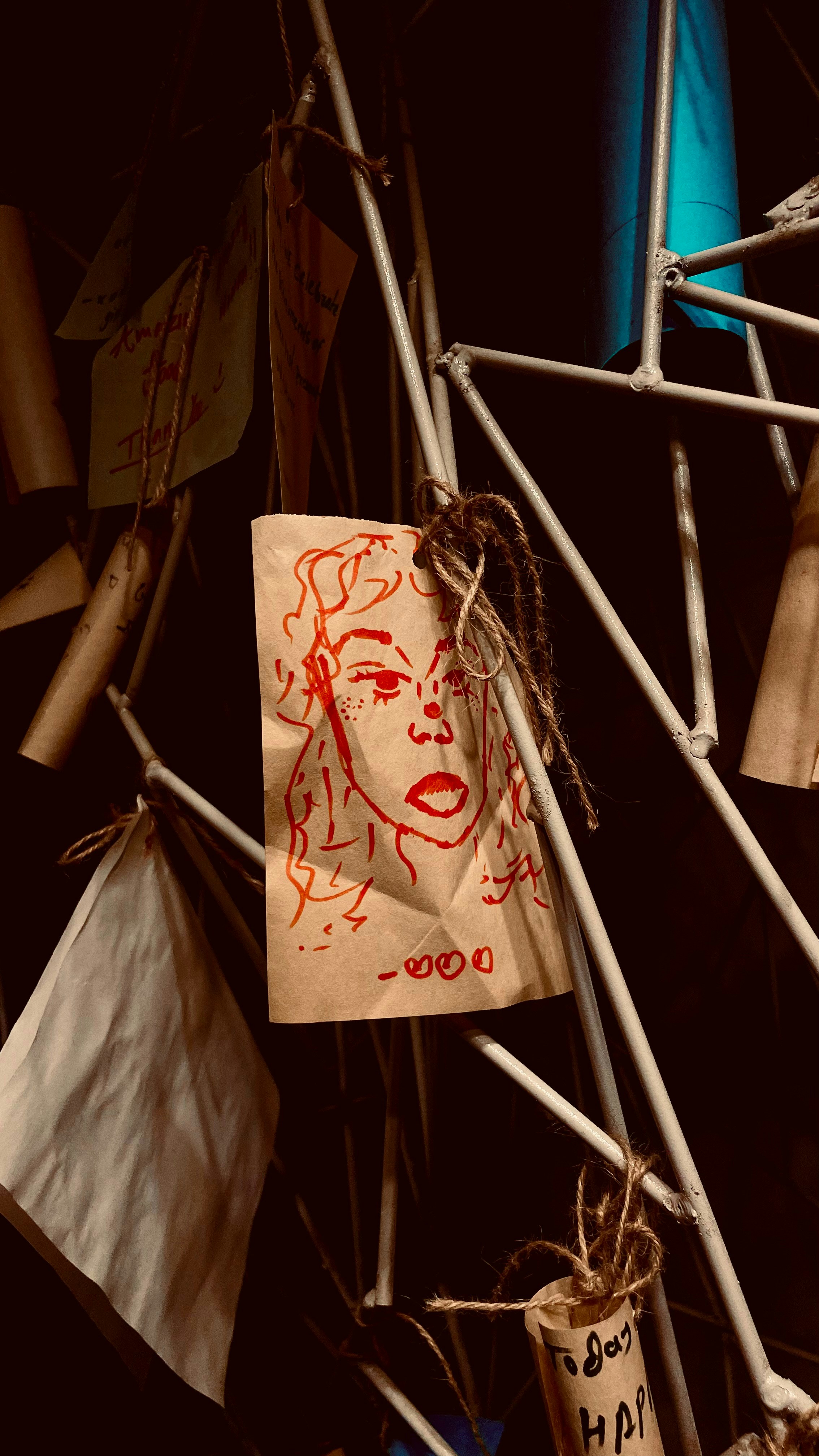 A bunch of clothes pins with a drawing on them