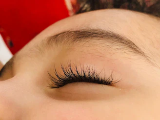 A close up of a person with long eyelashes