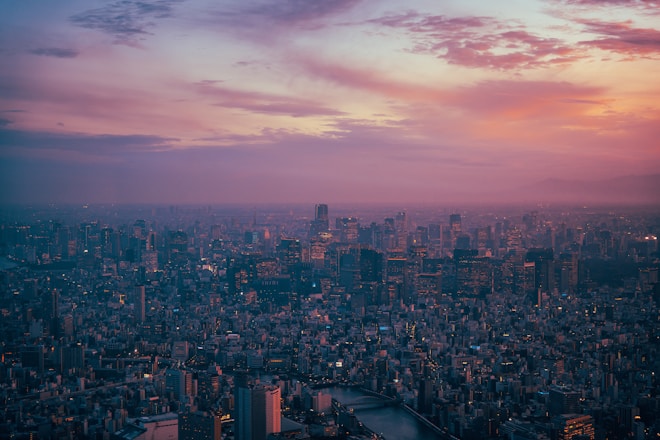 An aerial view of a city at sunset