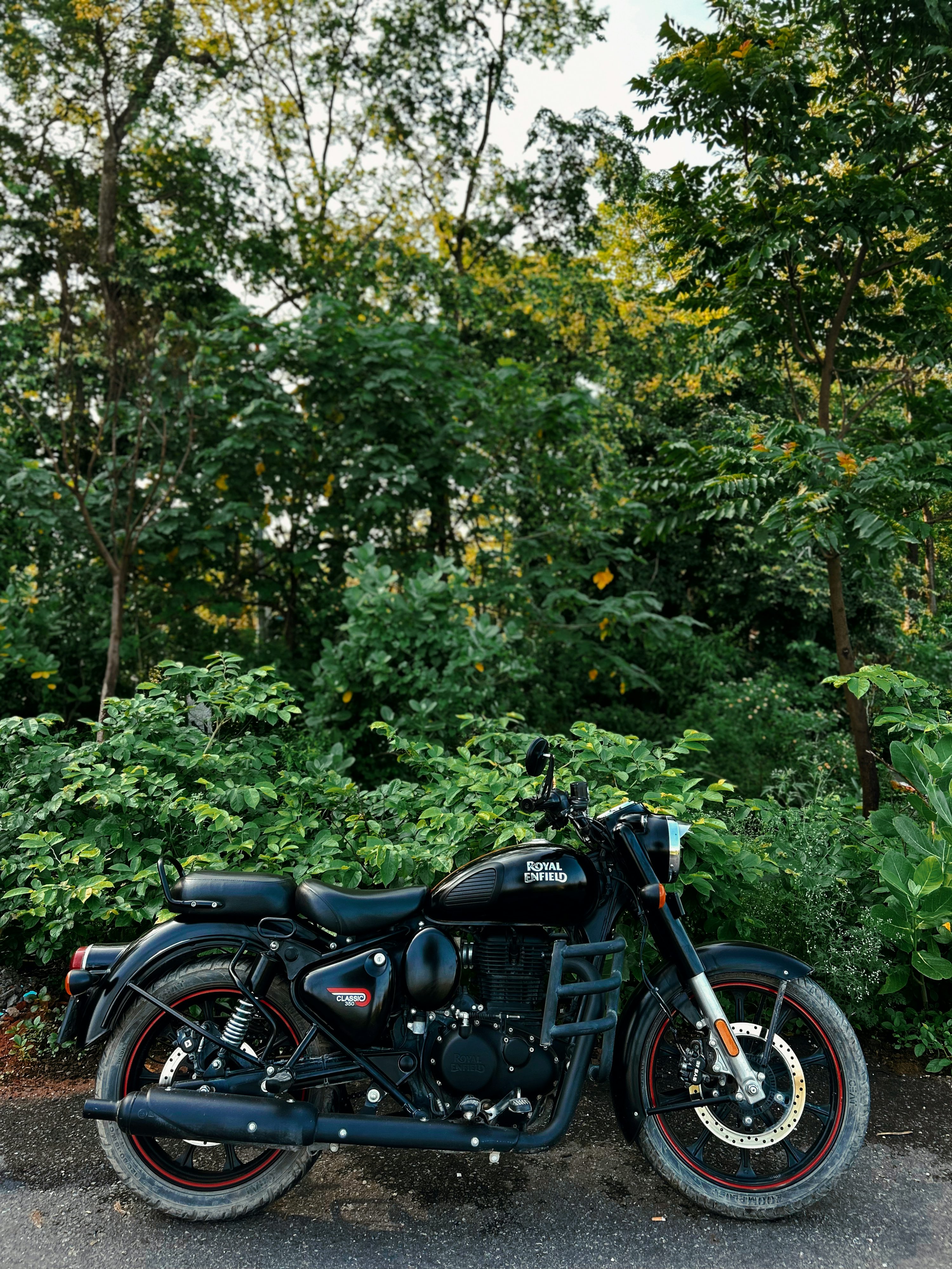 A black motorcycle parked on the side of a road