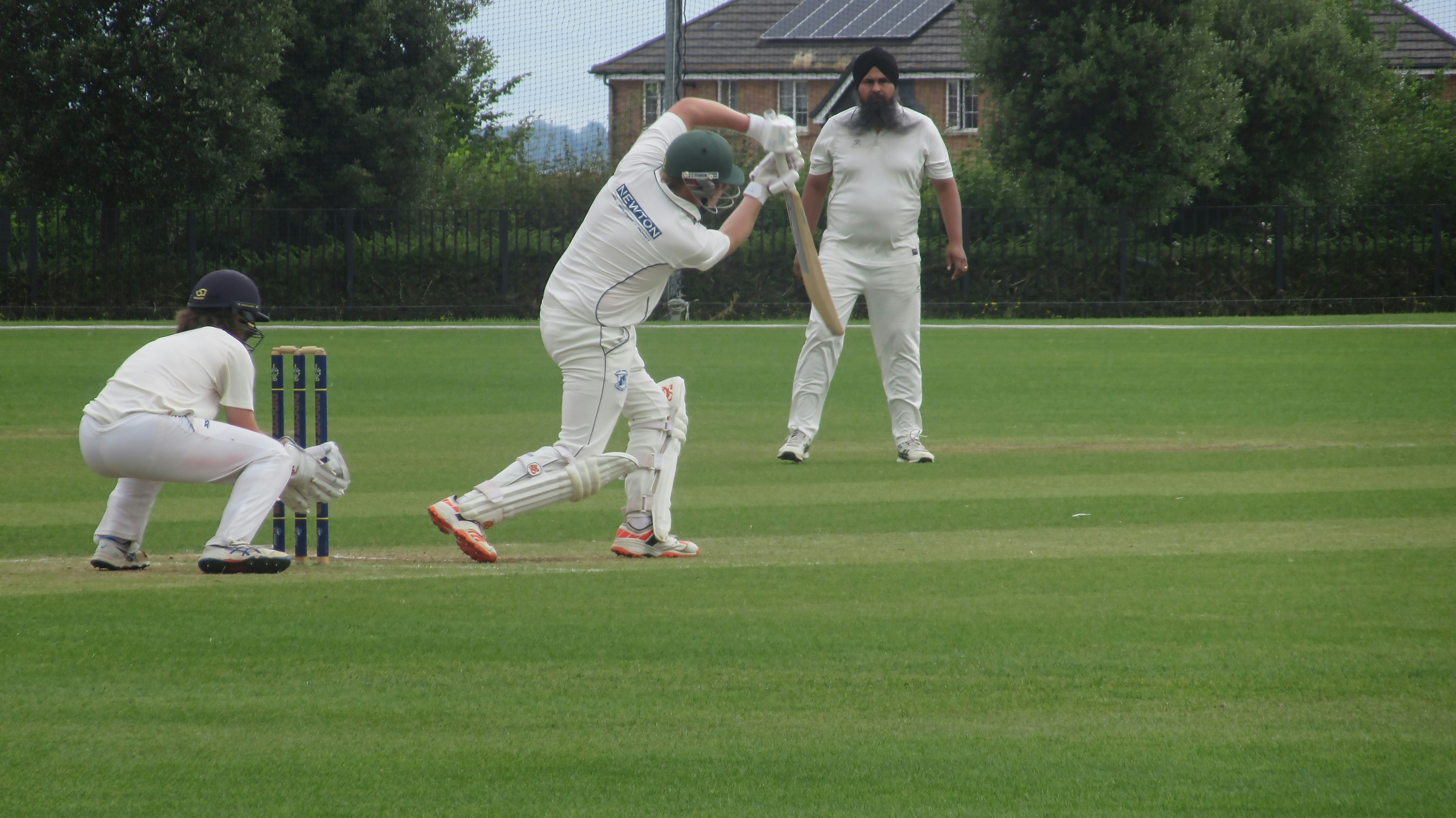 A group of men playing a game of cricket