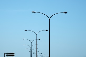 A couple of street lights sitting on the side of a road