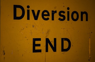 A yellow sign that says diversion end