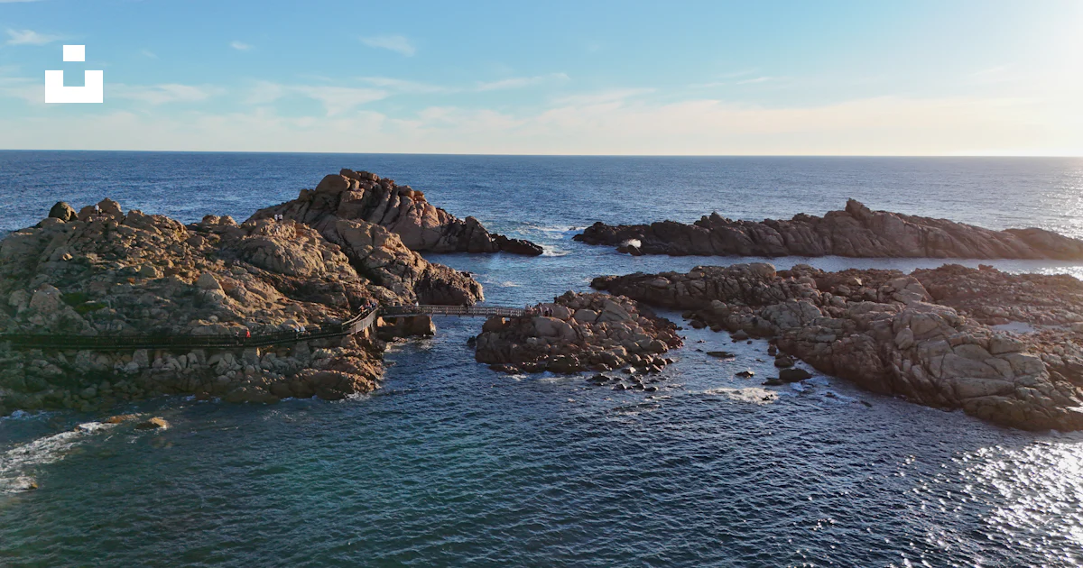 Canal Rocks Map An aerial view of the ocean with rocks in the foreground photo – Free ...