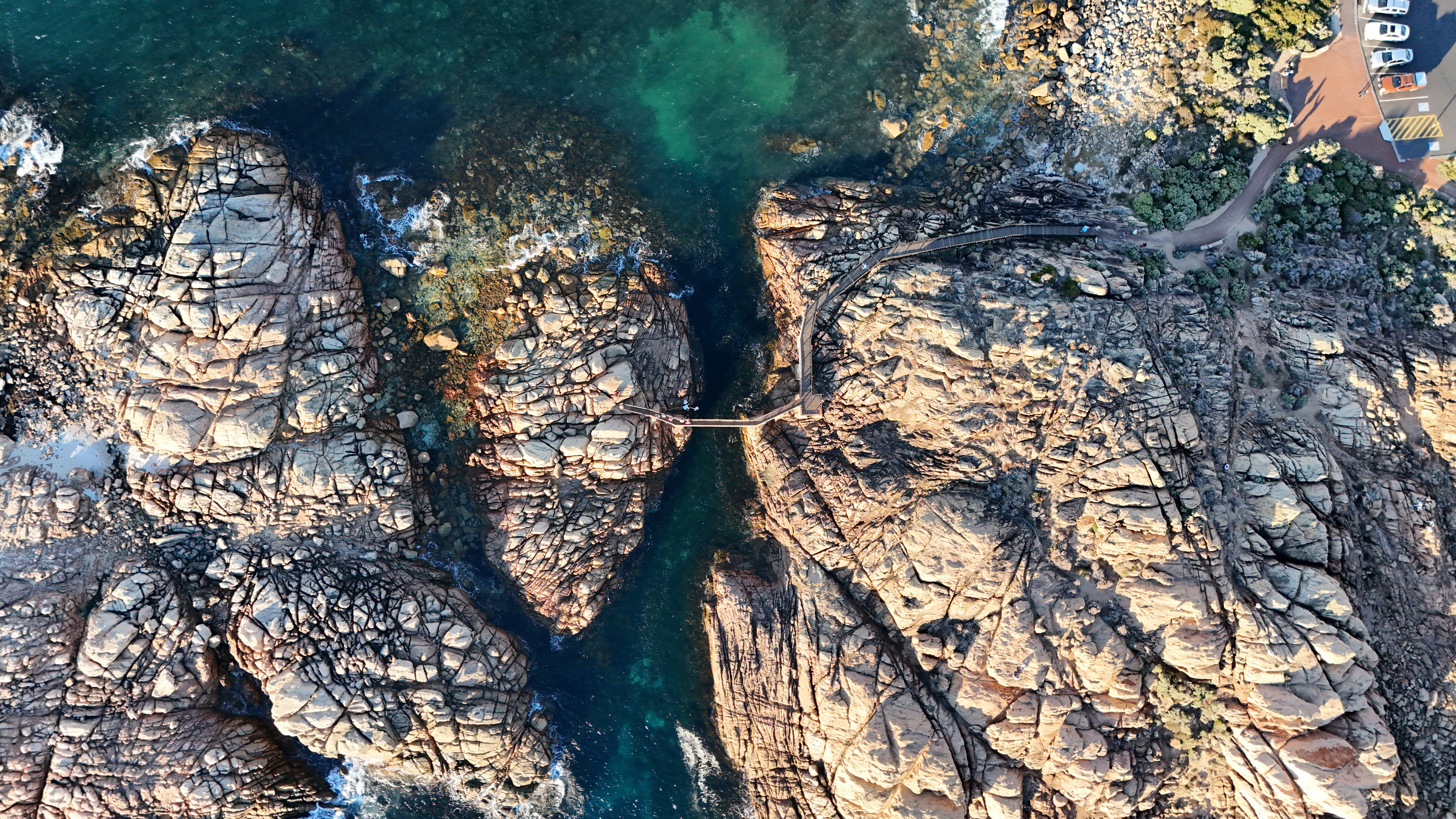 An aerial view of some rocks and water