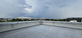 A cloudy sky is seen over a rooftop