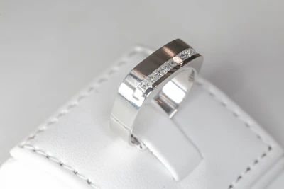 A couple of rings sitting on top of a white piece of luggage
