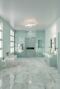 A large bathroom with a tub, sink, and shower