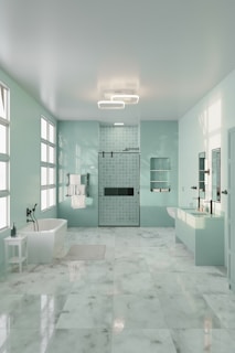 A large bathroom with a tub, sink, and shower