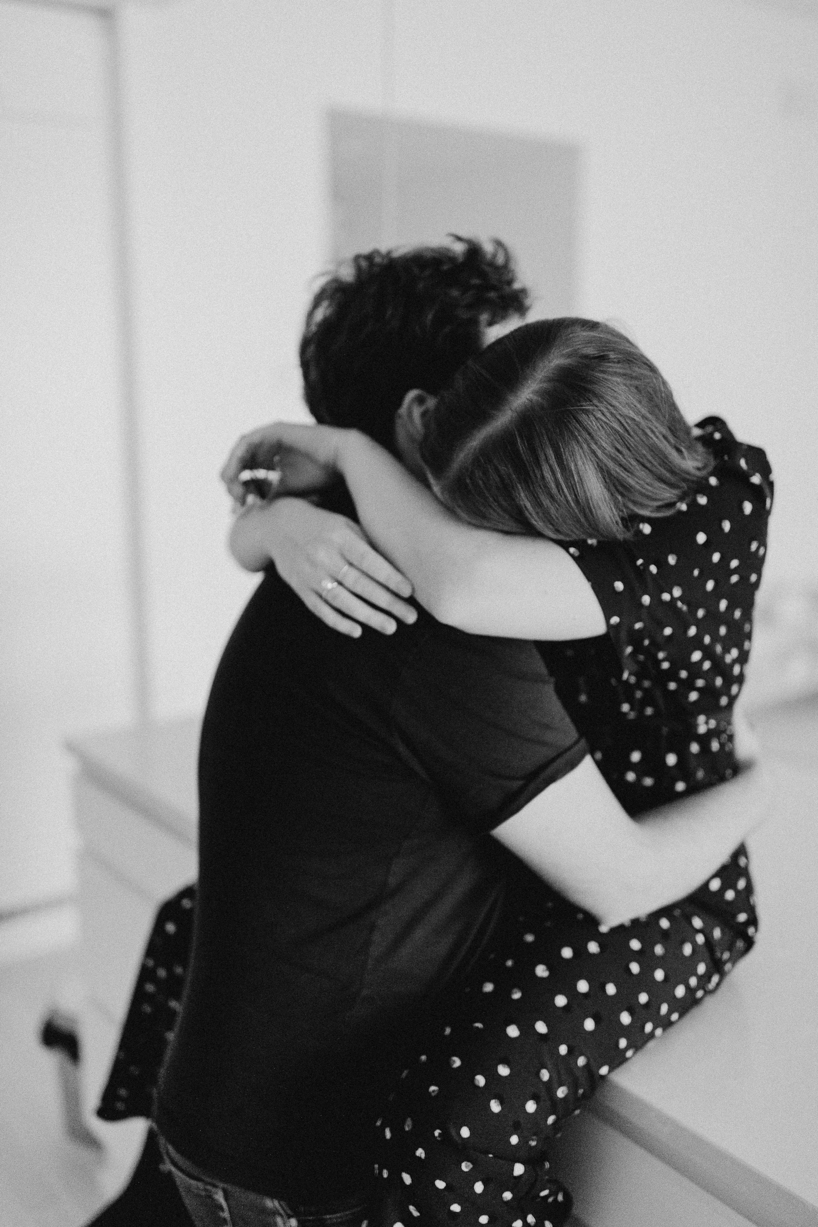 Couple holding each other close