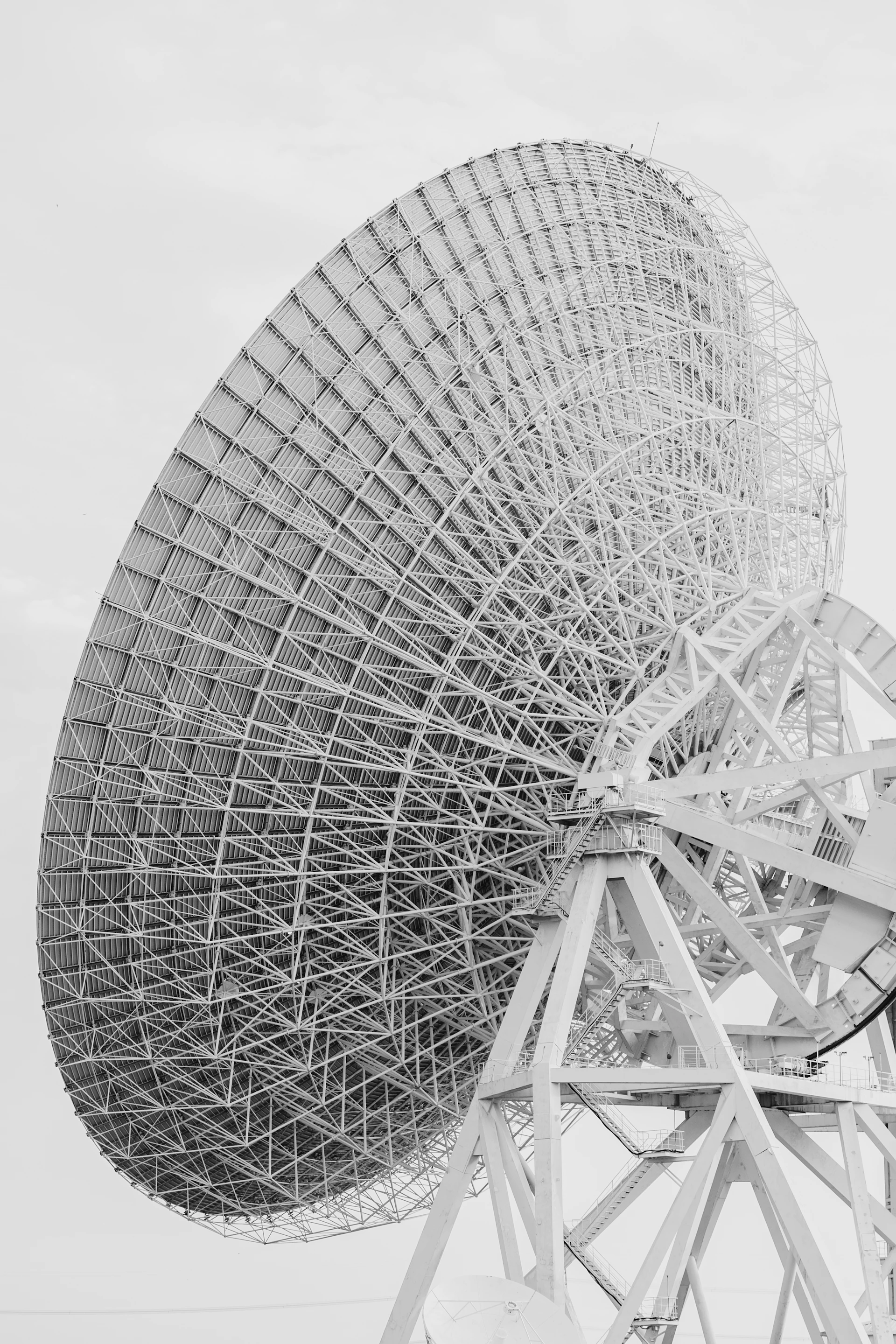 A black and white photo of a satellite dish